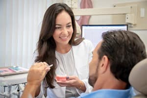 Dr. Aller treats a patient at Miracle Smile